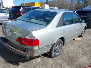 2004 Toyota Avalon XL z VIN 4T1BF28B64U340420, wystawiony jako IAAI lot #41753265 z przebiegiem 173 302 mil mil oraz . Historia ofert i sprzedaży dostępna na DreamBid. Obrazek 4.