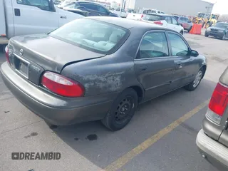 2001 Mazda 626 LX with VIN 1YVGF22C815218444, listed as a IAAI auction lot 41940404 with 143,080 mi miles. Bid and sale history available at carsss.com. Image 4.