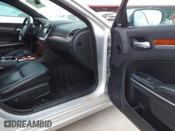 2012 Chrysler 300 Limited with VIN 2C3CCACG9CH223032, listed as a IAAI auction lot 42144147 with 139,625 mi miles. Bid and sale history available at carsss.com. Image 5.