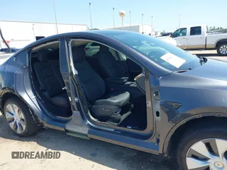 2024 Tesla Model Y with VIN 7SAYGDED2RF040745, listed as a IAAI auction lot 41986613 with 9,778 mi miles and . Bid and sale history available at DreamBid. Image 20.