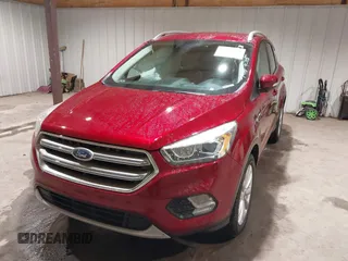 2017 Ford Escape Titanium z VIN 1FMCU9J9XHUC20359, wystawiony jako IAAI lot #41938688 z przebiegiem 79 743 mil mil oraz . Historia ofert i sprzedaży dostępna na DreamBid. Obrazek 2.