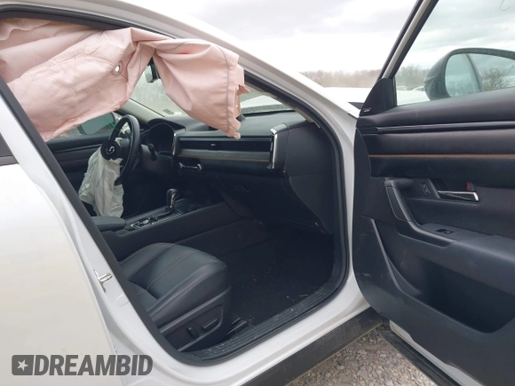 2023 Mazda CX-50 S Premium Plus with VIN 7MMVABEM7PN108865, listed as a IAAI auction lot 42049215 with 33,285 mi miles and . Bid and sale history available at DreamBid. Image 5.