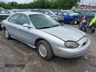 1996 Mercury Sable LS z VIN 1MELM53S7TA611510, wystawiony jako IAAI lot #42508427 z przebiegiem 131 239 mil mil oraz . Historia ofert i sprzedaży dostępna na DreamBid. Obrazek 1.