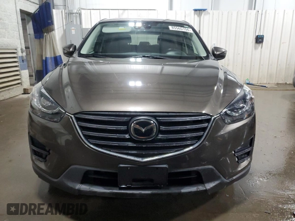 2016 Mazda CX-5 Grand Touring with VIN JM3KE4DY4G0600877, listed as a Copart auction lot 85560194 with 82,395 mi miles and Salvage Title. Bid and sale history available at carsss.com. Image 5.