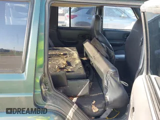 1999 Jeep Cherokee Sport with VIN 1J4FF68SXXL677013, listed as a IAAI auction lot 41993355 with 228,722 mi miles. Bid and sale history available at carsss.com. Image 8.