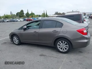 2012 Honda Civic EX with VIN 2HGFB2F89CH517330, listed as a IAAI auction lot 42116208 with 196,861 mi miles and . Bid and sale history available at DreamBid. Image 14.