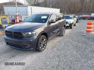 2015 Dodge Durango SXT with VIN 1C4RDJAG4FC784865, listed as a IAAI auction lot 40872452 with 145,877 mi miles and . Bid and sale history available at carsss.com. Image 2.