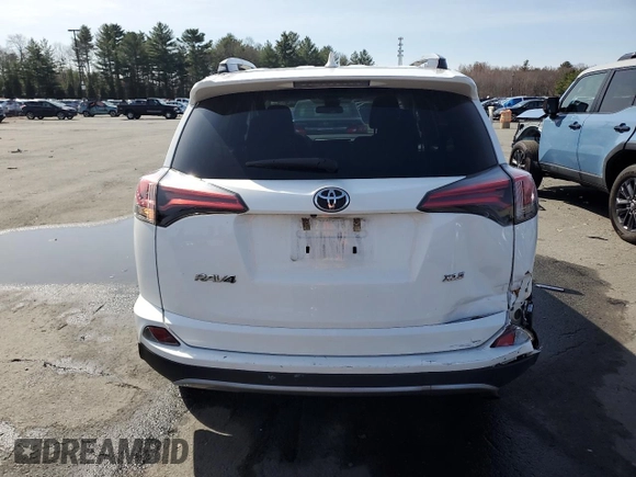 2018 Toyota RAV4 XLE with VIN 2T3WFREV4JW476959, listed as a Copart auction lot 51593265 with 198,596 mi miles and Salvage Title. Bid and sale history available at DreamBid. Image 6.