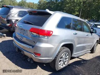 2014 Jeep Grand Cherokee Overland with VIN 1C4RJFCM4EC316142, listed as a IAAI auction lot 40607061 with 195,008 mi miles. Bid and sale history available at carsss.com. Image 4.