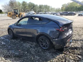 2024 Tesla Model Y Long Range with VIN 7SAYGDEE7RA307013, listed as a Copart auction lot 54767595 with 12,953 mi miles and Salvage Title. Bid and sale history available at DreamBid. Image 2.
