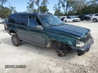 1996 Jeep Grand Cherokee Laredo with VIN 1J4GZ58S1TC340018, listed as a Copart auction lot 86571454 with 0 mi miles and Salvage Title. Bid and sale history available at carsss.com. Image 4.