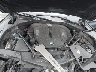 2015 BMW 7 Series 750i xDrive with VIN WBAYB6C59FD965820, listed as a IAAI auction lot 41558215 with 142,617 mi miles. Bid and sale history available at carsss.com. Image 10.