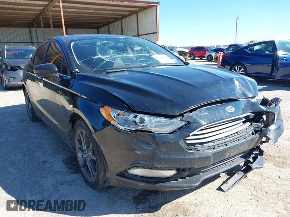 2018 Ford Fusion SE z VIN 3FA6P0H77JR180057, wystawiony jako IAAI lot #41729451 z przebiegiem 122 200 mil mil oraz . Historia ofert i sprzedaży dostępna na DreamBid. Obrazek 1.