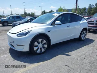 2023 Tesla Model Y Long Range with VIN 7SAYGAEE5PF855834, listed as a IAAI auction lot 41943491 with 34,480 mi miles. Bid and sale history available at carsss.com. Image 2.
