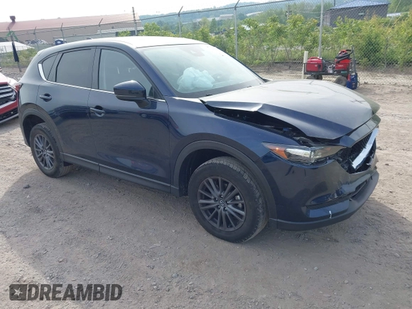 2021 Mazda CX-5 Touring z VIN JM3KFBCMXM0389857, wystawiony jako IAAI lot #42309650 z przebiegiem 49 938 mil mil oraz . Historia ofert i sprzedaży dostępna na DreamBid. Obrazek 1.