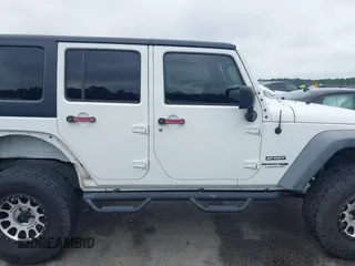 2018 Jeep Wrangler Unlimited Sport S with VIN 1C4BJWDG6JL818719, listed as a IAAI auction lot 42412991 with 58,399 mi miles and . Bid and sale history available at DreamBid. Image 13.