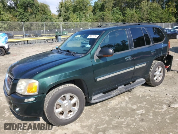 2003 GMC Envoy SLT with VIN 1GKDT13S032396374, listed as a Copart auction lot 74675134 with 115,280 mi miles and Salvage Title. Bid and sale history available at DreamBid. Image 1.
