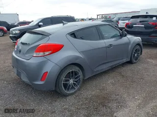 2016 Hyundai Veloster with VIN KMHTC6AD5GU297452, listed as a IAAI auction lot 41142723 with 101,417 mi miles. Bid and sale history available at carsss.com. Image 4.
