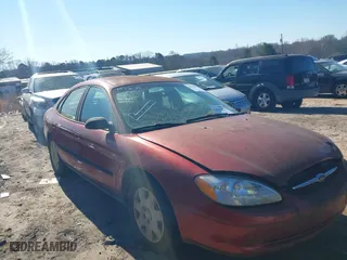 2001 Ford Taurus LX with VIN 1FAFP52UX1A139542, listed as a IAAI auction lot 41670297 with 128,676 mi miles. Bid and sale history available at carsss.com. Image 1.