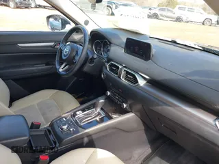 2020 Mazda CX-5 Touring z VIN JM3KFBCMXL1741182, wystawiony jako IAAI lot #41602315 z przebiegiem 31 582 mil mil oraz . Historia ofert i sprzedaży dostępna na DreamBid. Obrazek 5.
