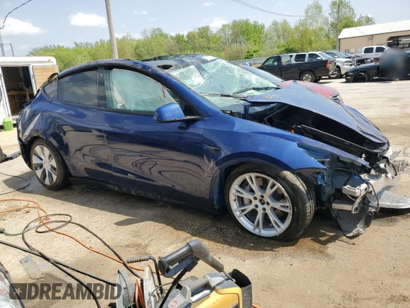2022 Tesla Model Y Long Range z VIN 7SAYGDEE8NF447410, wystawiony jako Copart lot #54860765 z przebiegiem Nie podano mil oraz Szkody całkowita. Historia ofert i sprzedaży dostępna na DreamBid. Obrazek 4.