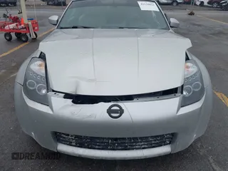 2003 Nissan 350Z Touring z VIN JN1AZ34E43T014247, wystawiony jako IAAI lot #42120812 z przebiegiem 112 263 mil mil oraz . Historia ofert i sprzedaży dostępna na DreamBid. Obrazek 6.