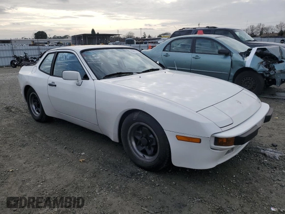 1984 Porsche 944 with VIN WP0AA0944EN453622, listed as a Copart auction lot 85871944 with 92,382 mi miles and Salvage Title. Bid and sale history available at DreamBid. Image 4.