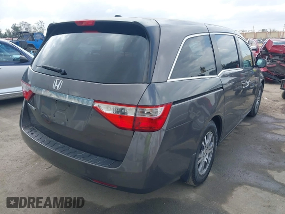 2011 Honda Odyssey EX-L with VIN 5FNRL5H61BB072124, listed as a IAAI auction lot 42115299 with 155,086 mi miles and . Bid and sale history available at DreamBid. Image 4.