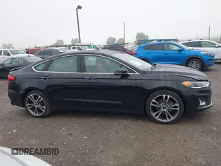 2019 Ford Fusion Titanium with VIN 3FA6P0D92KR125864, listed as a IAAI auction lot 42425422 with 109,340 mi miles and . Bid and sale history available at DreamBid. Image 13.