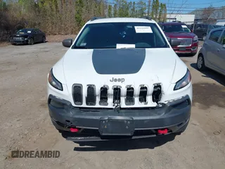 2014 Jeep Cherokee Trailhawk with VIN 1C4PJMBS8EW163212, listed as a IAAI auction lot 42124107 with 114,999 mi miles. Bid and sale history available at carsss.com. Image 12.