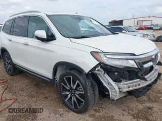 2019 Honda Pilot Touring 8-Passenger with VIN 5FNYF5H94KB005563, listed as a IAAI auction lot 42059065 with 117,794 mi miles and . Bid and sale history available at DreamBid. Image 1.