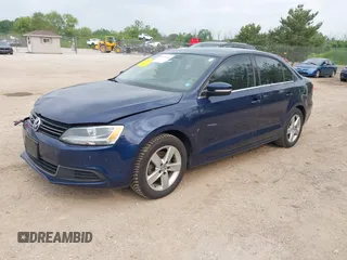 2014 Volkswagen Jetta TDI w/Premium/Nav z VIN 3VWLL7AJ8EM266890, wystawiony jako IAAI lot #42473906 z przebiegiem 146 306 mil mil oraz . Historia ofert i sprzedaży dostępna na DreamBid. Obrazek 2.