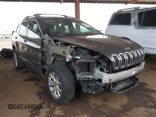 2014 Jeep Cherokee Latitude z VIN 1C4PJMCB1EW320478, wystawiony jako IAAI lot #41728233 z przebiegiem 140 501 mil mil oraz . Historia ofert i sprzedaży dostępna na DreamBid. Obrazek 1.