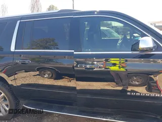 2019 Chevrolet Suburban LT with VIN 1GNSCJKC5KR360318, listed as a IAAI auction lot 41504344 with 82,997 mi miles and . Bid and sale history available at DreamBid. Image 13.