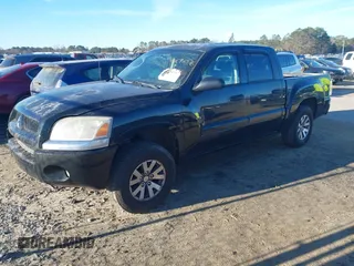2009 Mitsubishi Raider LS z VIN 1Z7HC28K89S729753, wystawiony jako IAAI lot #41696576 z przebiegiem 169 373 mil mil oraz . Historia ofert i sprzedaży dostępna na DreamBid. Obrazek 2.