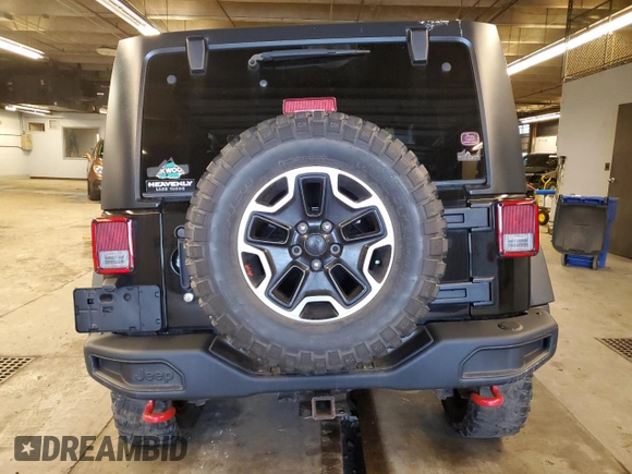 2013 Jeep Wrangler Rubicon with VIN 1C4HJWCG6DL666540, listed as a Copart auction lot 79337404 with 130,448 mi miles and Salvage title. Bid and sale history available at DreamBid. Image 6.