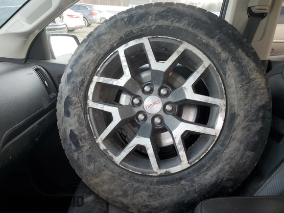2015 GMC Canyon 4WD SLE with VIN 1GTG6BE34F1165547, listed as a Copart auction lot 43930715 with 124,970 mi miles and Salvage Title. Bid and sale history available at carsss.com. Image 14.