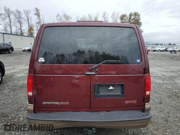 2003 GMC Safari z VIN 1GKEL19X63B510272, wystawiony jako Copart lot #75436594 z przebiegiem 31 989 mil mil oraz Szkody całkowita. Historia ofert i sprzedaży dostępna na DreamBid. Obrazek 6.