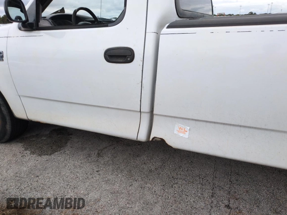 2003 Ford F-150 XL with VIN 1FTRF17W03NA02988, listed as a Copart auction lot 77209084 with Not Provided miles and Salvage Title. Bid and sale history available at DreamBid. Image 12.