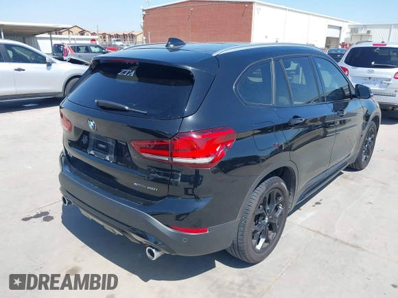 2021 BMW X1 sDrive28i with VIN WBXJG7C07M3M65841, listed as a IAAI auction lot 41877032 with 79,817 mi miles and . Bid and sale history available at DreamBid. Image 4.