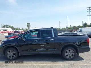 2020 Honda Ridgeline RTL-E with VIN 5FPYK3F70LB009376, listed as a IAAI auction lot 42488529 with 30,932 mi miles and . Bid and sale history available at DreamBid. Image 14.