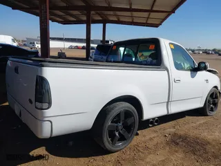 1999 Ford F-150 Work Series with VIN 1FTRF17W0XKA35108, listed as a IAAI auction lot 41383313 with 1 mi miles. Bid and sale history available at carsss.com. Image 4.