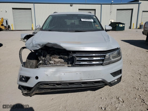 2018 Volkswagen Tiguan S with VIN 3VV1B7AX7JM013797, listed as a Copart auction lot 77445924 with 194,708 mi miles and Salvage Title. Bid and sale history available at carsss.com. Image 5.