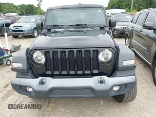 2019 Jeep Wrangler Unlimited Sport S with VIN 1C4HJXDG1KW603345, listed as a IAAI auction lot 42474523 with 90,048 mi miles and . Bid and sale history available at DreamBid. Image 12.