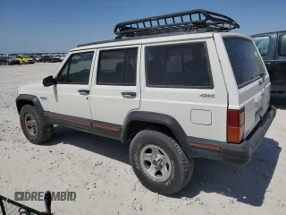 1996 Jeep Cherokee Sport with VIN 1J4FJ68S1TL128597, listed as a Copart auction lot 49600545 with 201,074 mi miles and Salvage title. Bid and sale history available at DreamBid. Image 2.