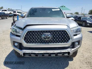 2018 Toyota Tacoma SR with VIN 3TMCZ5AN6JM129370, listed as a Copart auction lot 63042425 with 65,189 mi miles and Salvage title. Bid and sale history available at DreamBid. Image 5.