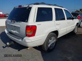 2001 Jeep Grand Cherokee Limited with VIN 1J4GW58S41C615418, listed as a IAAI auction lot 42141143 with 148,145 mi miles. Bid and sale history available at carsss.com. Image 4.