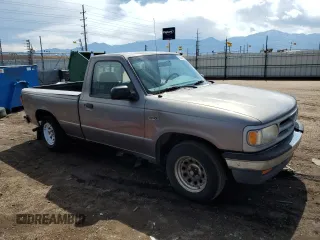 1997 Mazda B-Series Truck z VIN 4F4CR12A1VTM08969, wystawiony jako Copart lot #58539955 z przebiegiem 190 591 mil mil oraz Tytuł czysty. Historia ofert i sprzedaży dostępna na DreamBid. Obrazek 4.