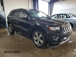 2014 Jeep Grand Cherokee Overland with VIN 1C4RJFCT9EC264594, listed as a Copart auction lot 50071695 with 124,712 mi miles and Clean Title. Bid and sale history available at DreamBid. Image 4.