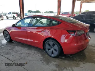 2022 Tesla Model 3 with VIN 5YJ3E1EA0NF329568, listed as a Copart auction lot 52594205 with 27,446 mi miles and Non Repairable. Bid and sale history available at carsss.com. Image 2.